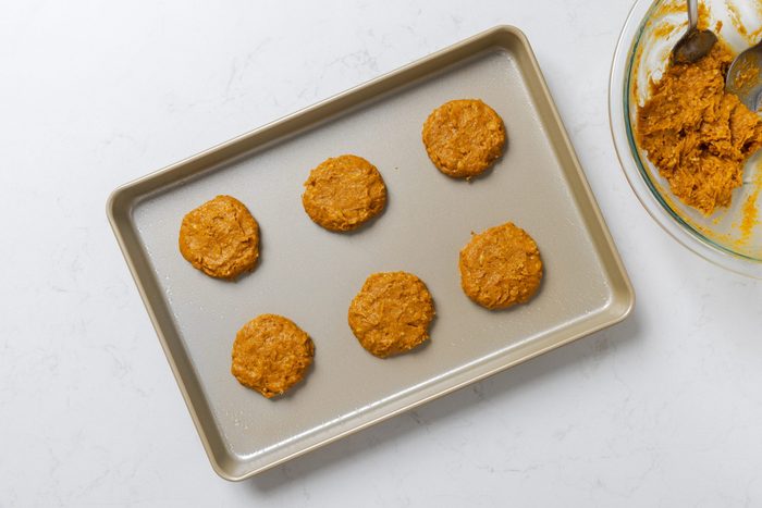Cookie dough placed in baking sheet.