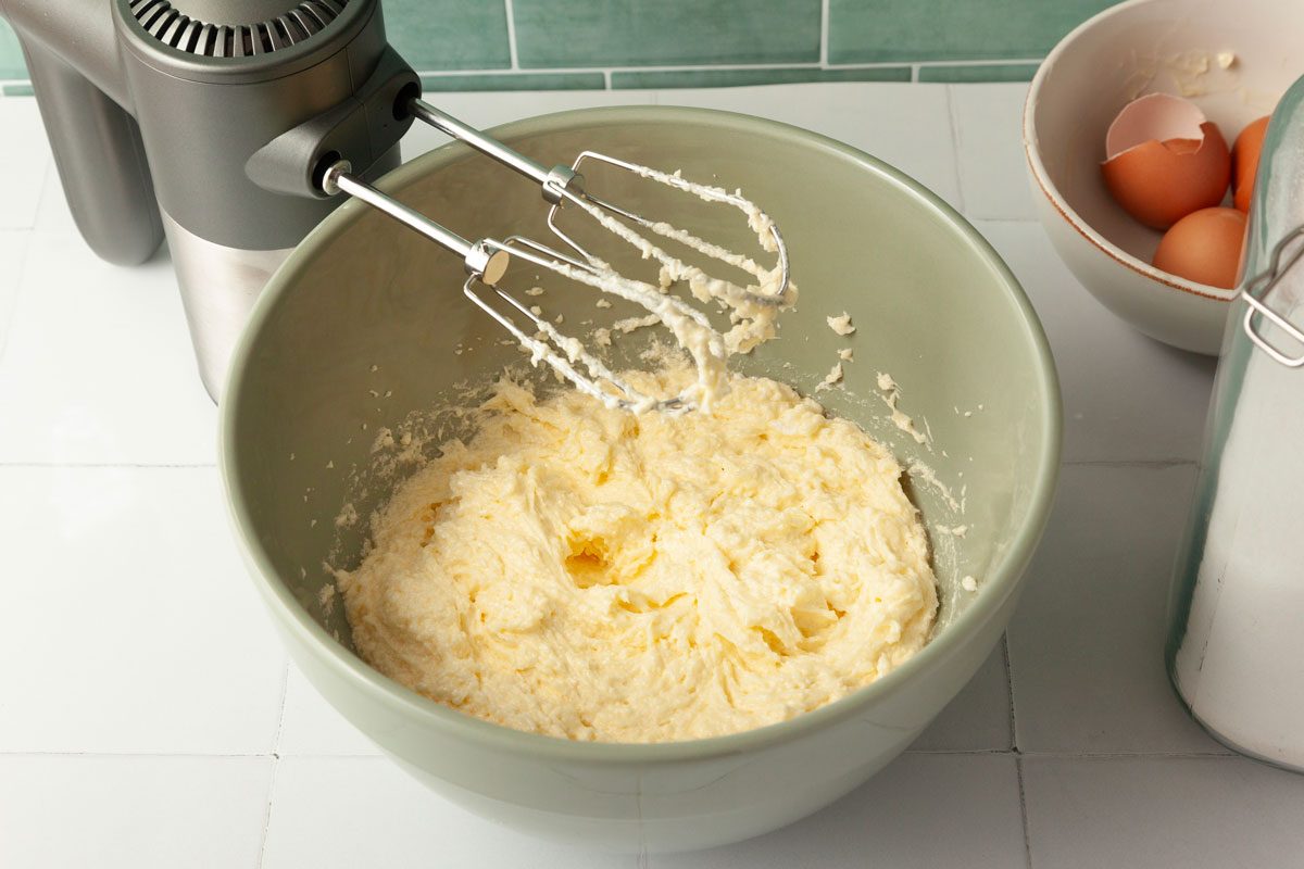 Step 1 of Taste of Home Rhubarb Cake is to cream together the butter and sugar until light and fluffy. Add the eggs, one at a time, beating well after each addition. Add the vanilla extract and mix well.