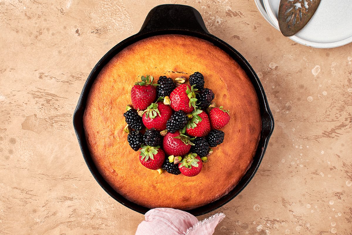 Serve this sweet, moist honey cake by Taste of Home with ripe berries and a sprinkle of crunchy pistachios.