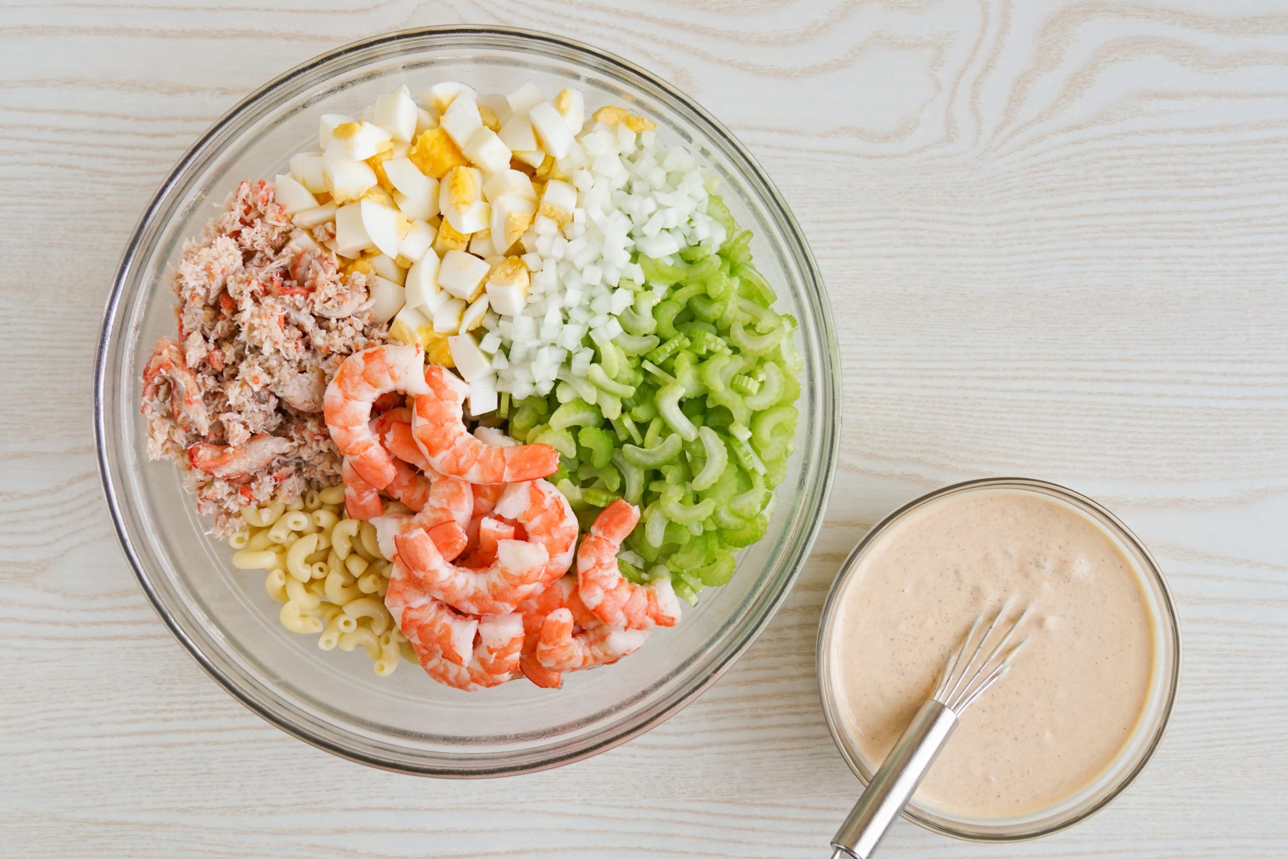Dressing seafood pasta salad