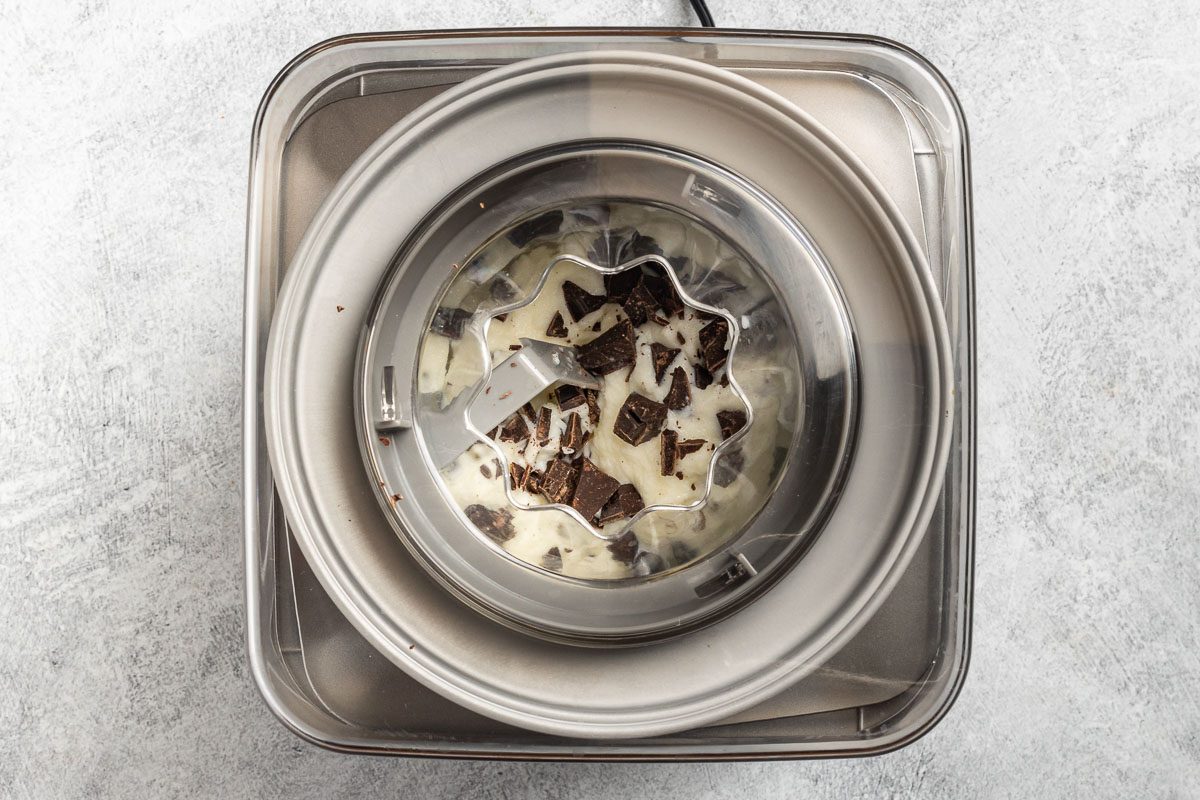 Taste of Home Stracciatella Gelato recipe photo of churning the gelato in an ice cream machine and adding the chocolate.