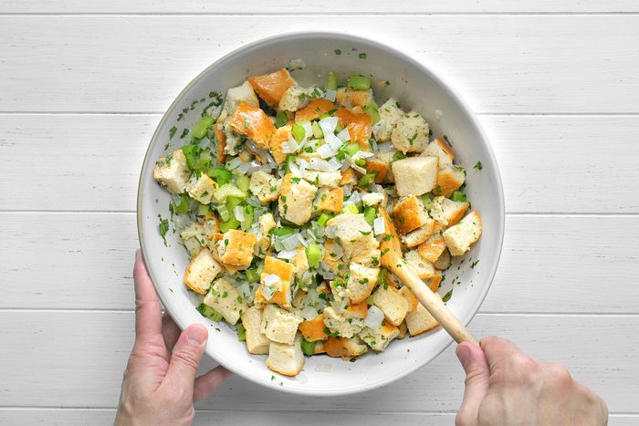 add the broth, parsley, sage, poultry seasoning, salt and pepper in a large bowl Gently stir in bread cubes until mixed.