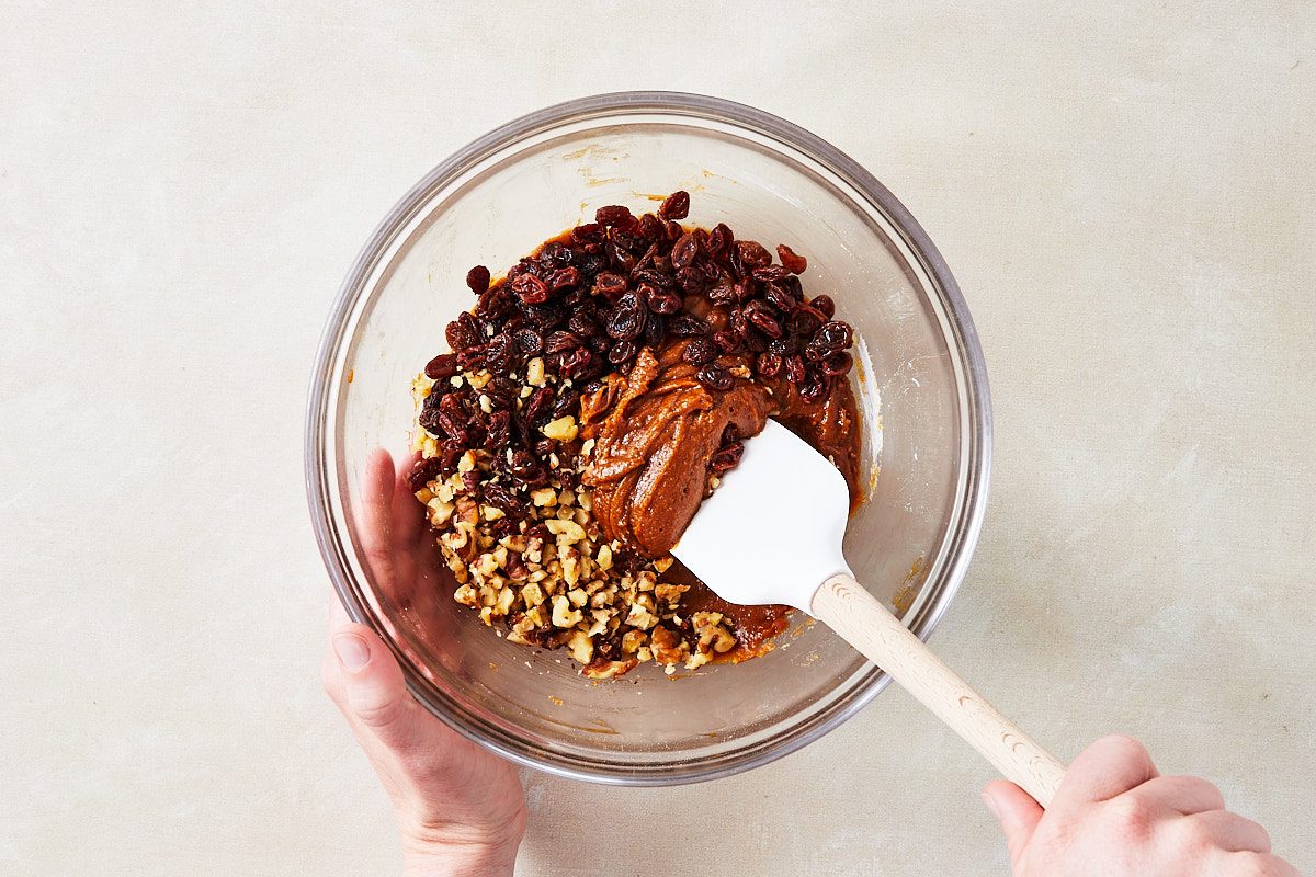 Hermit Cookies Step 2- folding raisins and walnuts into cookie dough