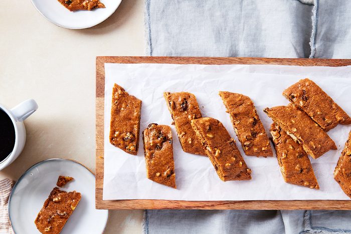 Hermit Cookies Hero- cookies arranged on wooden tray, coffee and plates surrounding