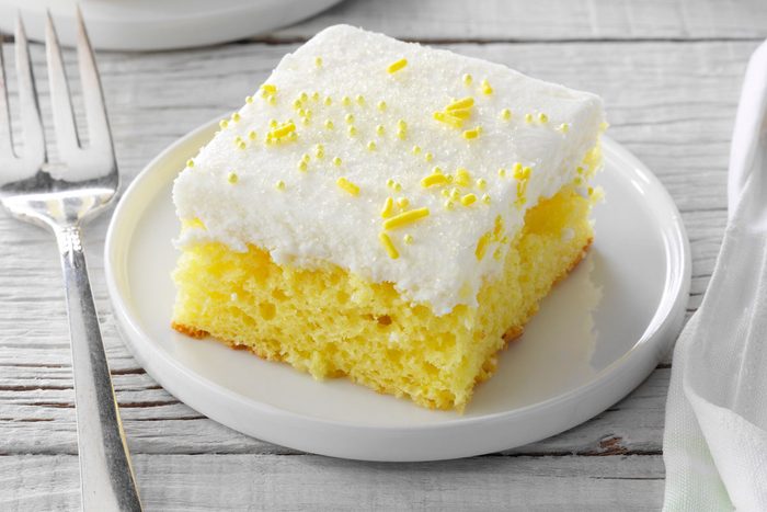 Lemon Sheet Cake slice on a plate