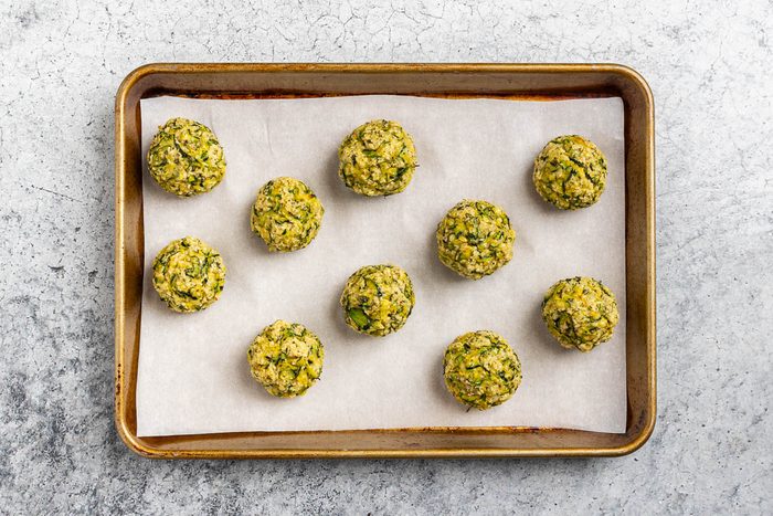 Taste of Home Zucchini Meatballs recipe photo of the baked zucchini meatballs on a baking sheet.