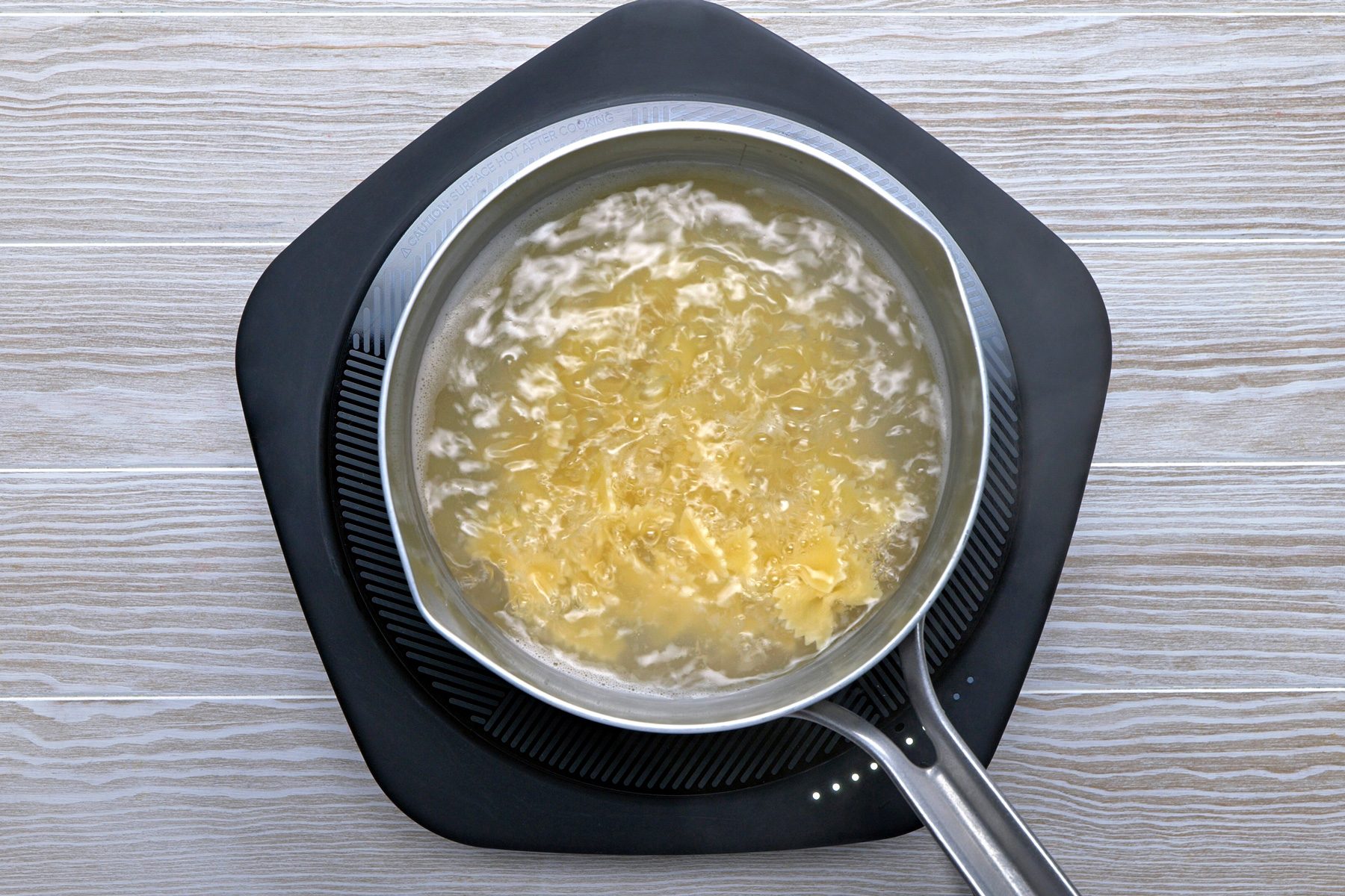 Overhead shot of cooking pasta in water