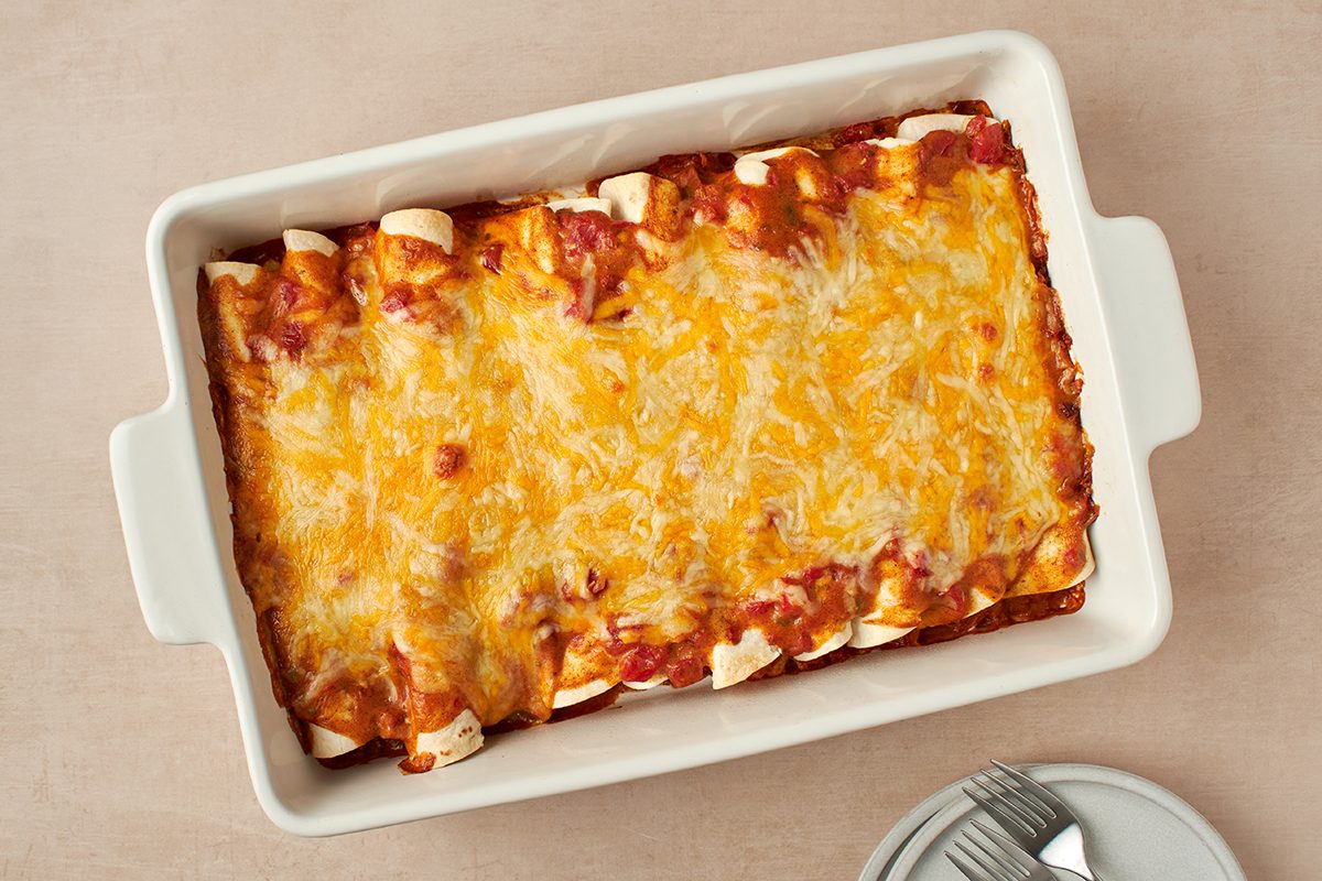 Find comfort and deliciousness in these easy-to-make chicken enchiladas with cream of chicken soup by Taste of Home.