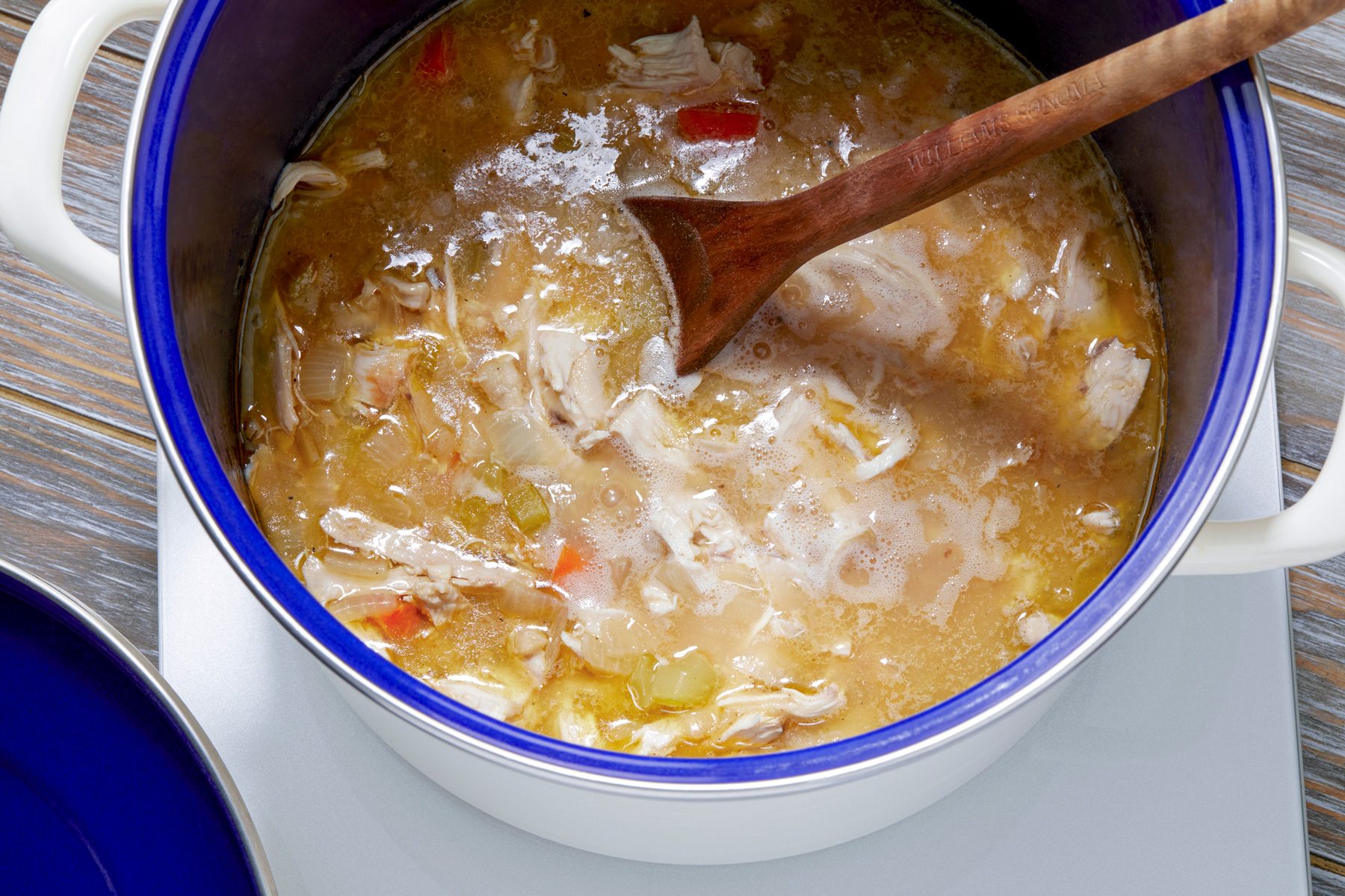 overhead shot; added shredded chicken in the stock pot high until simmer