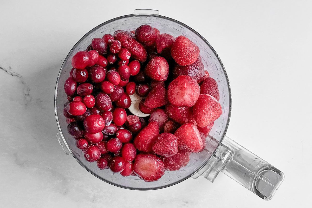 Cranberries and strawberries for Taste of Home Christmas Jam in a food processor