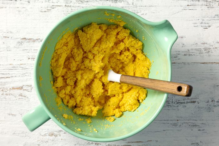 overhead shot of thick mixture of cornmeal in a large bowl