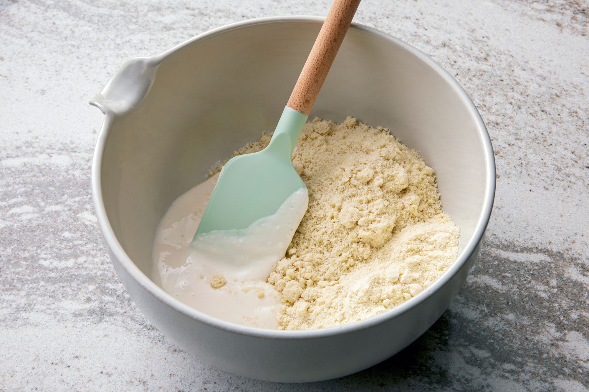 Transfer mixture to a large mixing bowl; stir in almond flour and protein powder
