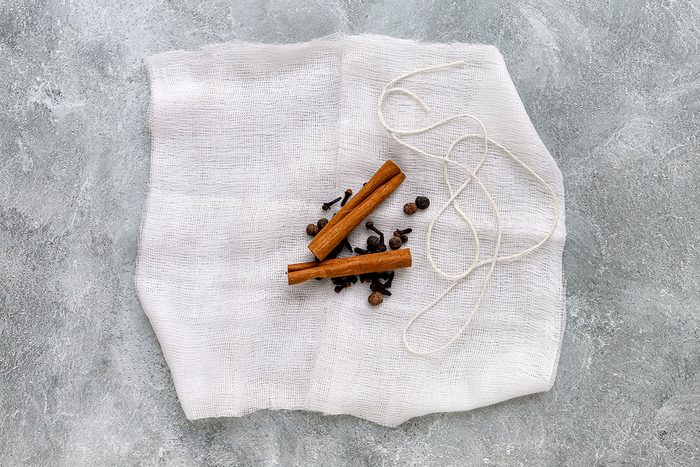 Making a spice bag for a crockpot apple cider recipe from Taste of Home.