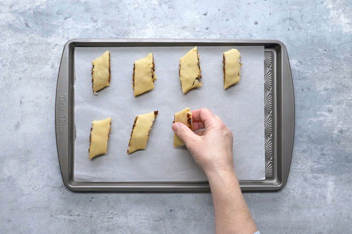 Place seam side down on parchment-lined baking sheets