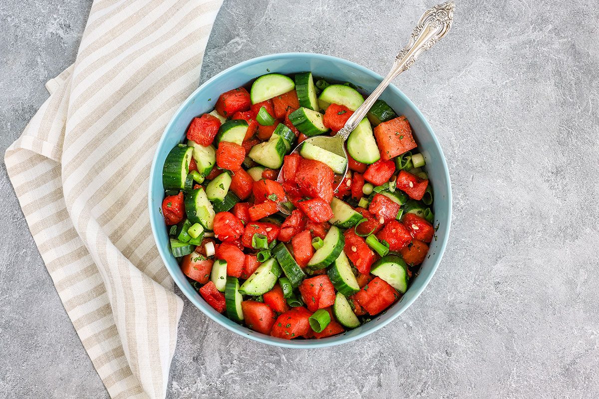 A cucumber watermelon salad in a serving bowl from Taste of Home.