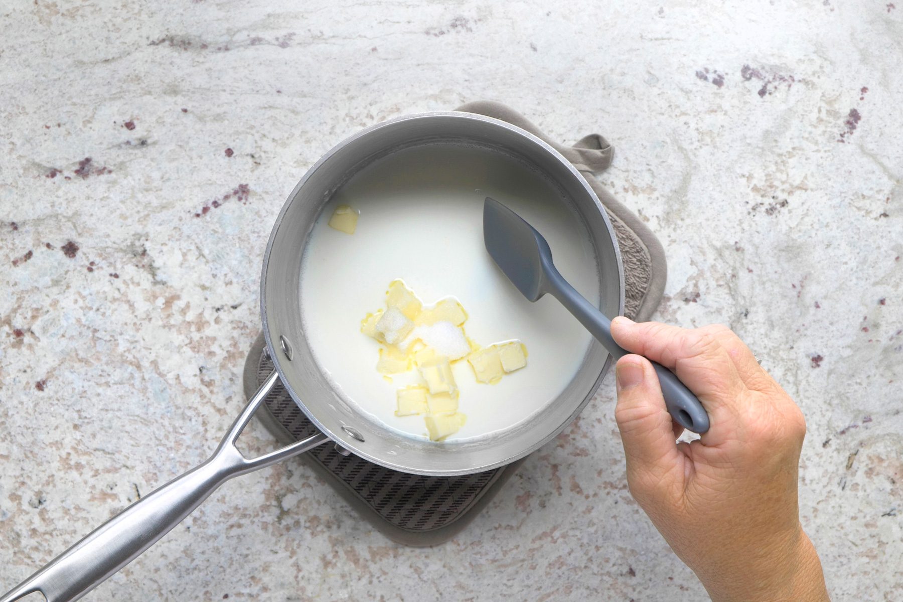 Stir until butter melts; cool to lukewarm.