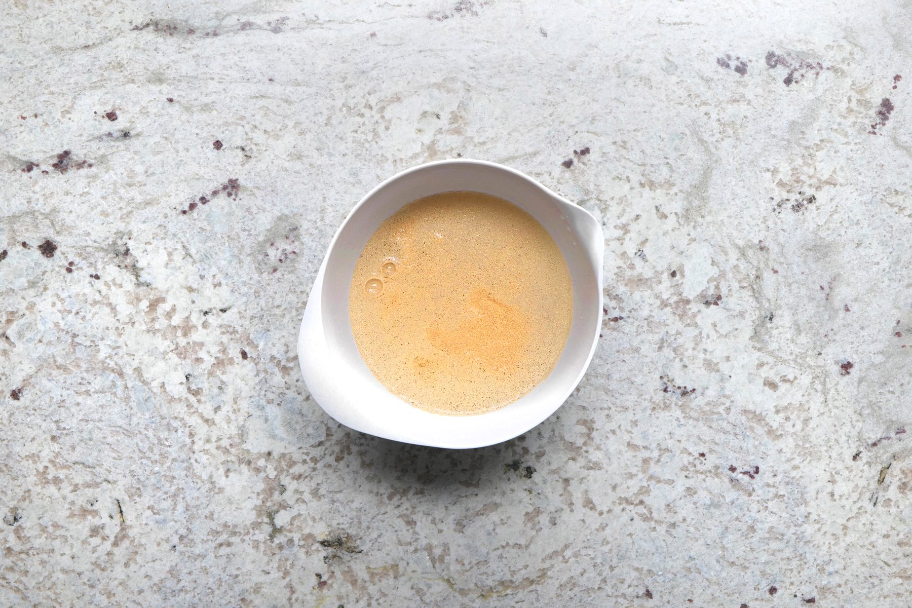 In a small bowl, dissolve yeast in warm water;