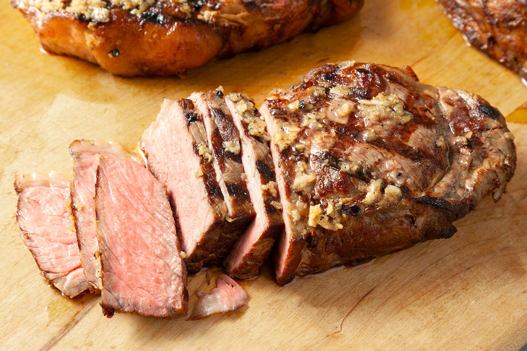 cut clices of grilled garlic steaks