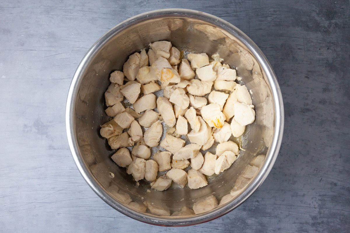 Step 3 of Taste of Home Instant Pot Chicken Curry is to pressure-cook on high for five minutes then let the pressure release naturally. Select the sauté setting and adjust to medium heat. In a small bowl, whisk together the cornstarch and a tablespoon water. Add the cornstarch mixture to the pot and let it simmer uncovered for five minutes.