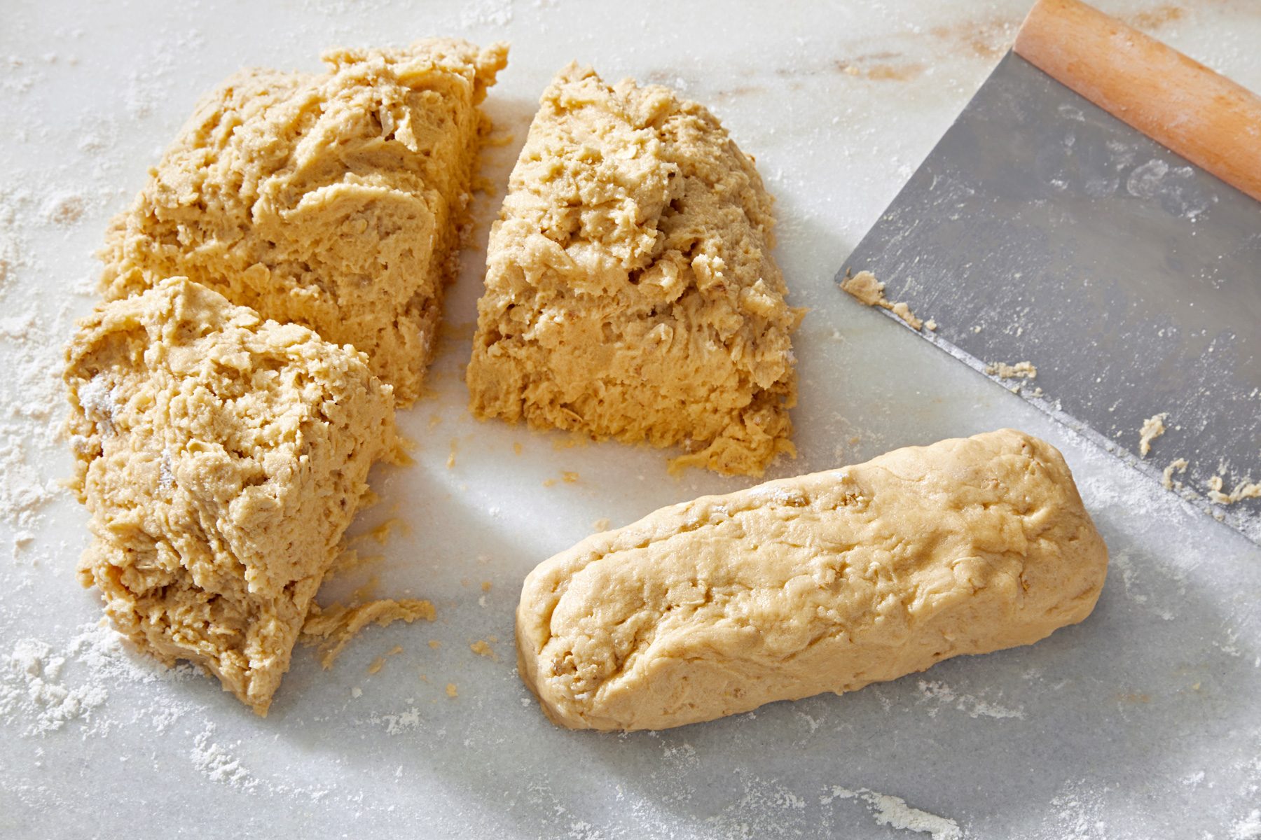 top view shot of cookie dough divided in four parts