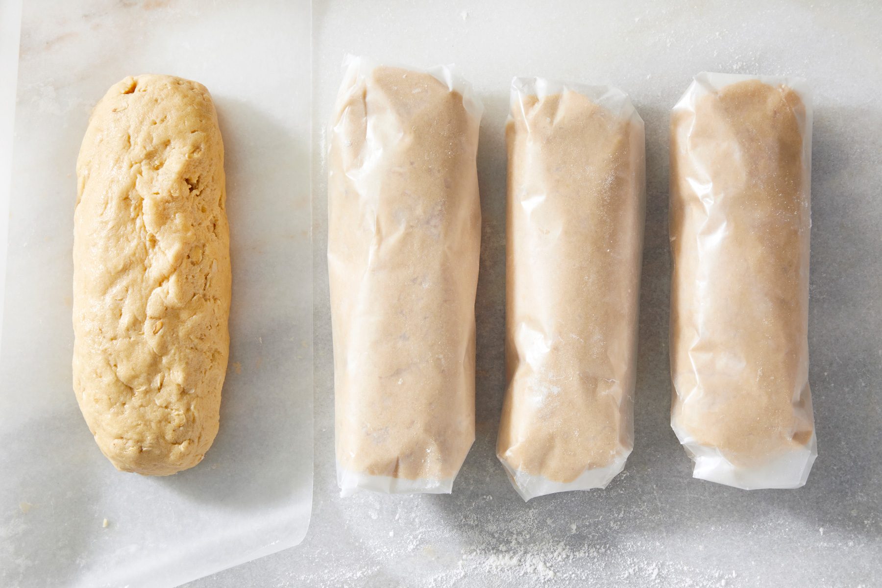 Top view shot of cookie dough rolled in baking sheet