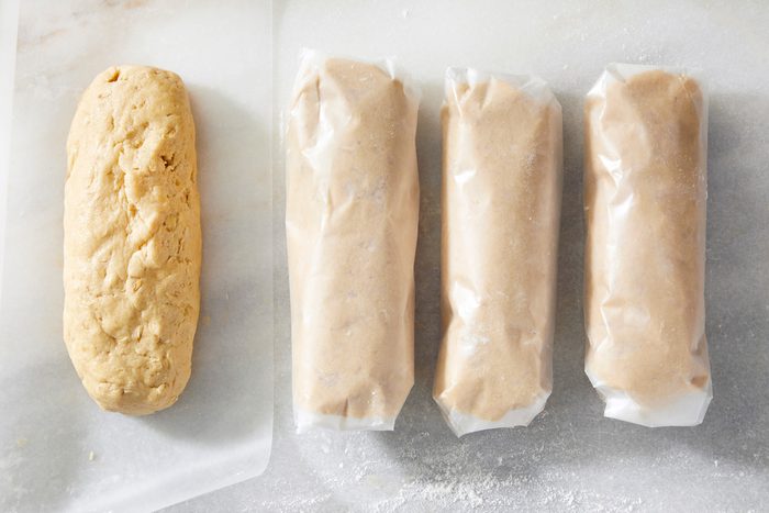 Top view shot of cookie dough rolled in baking sheet