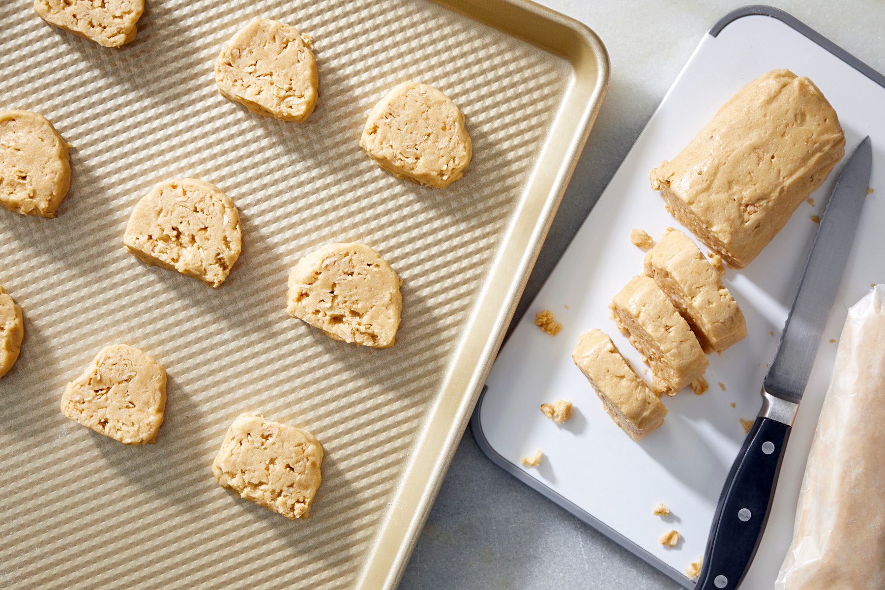 top view shot of cookie dough cut in small portions on baking tray