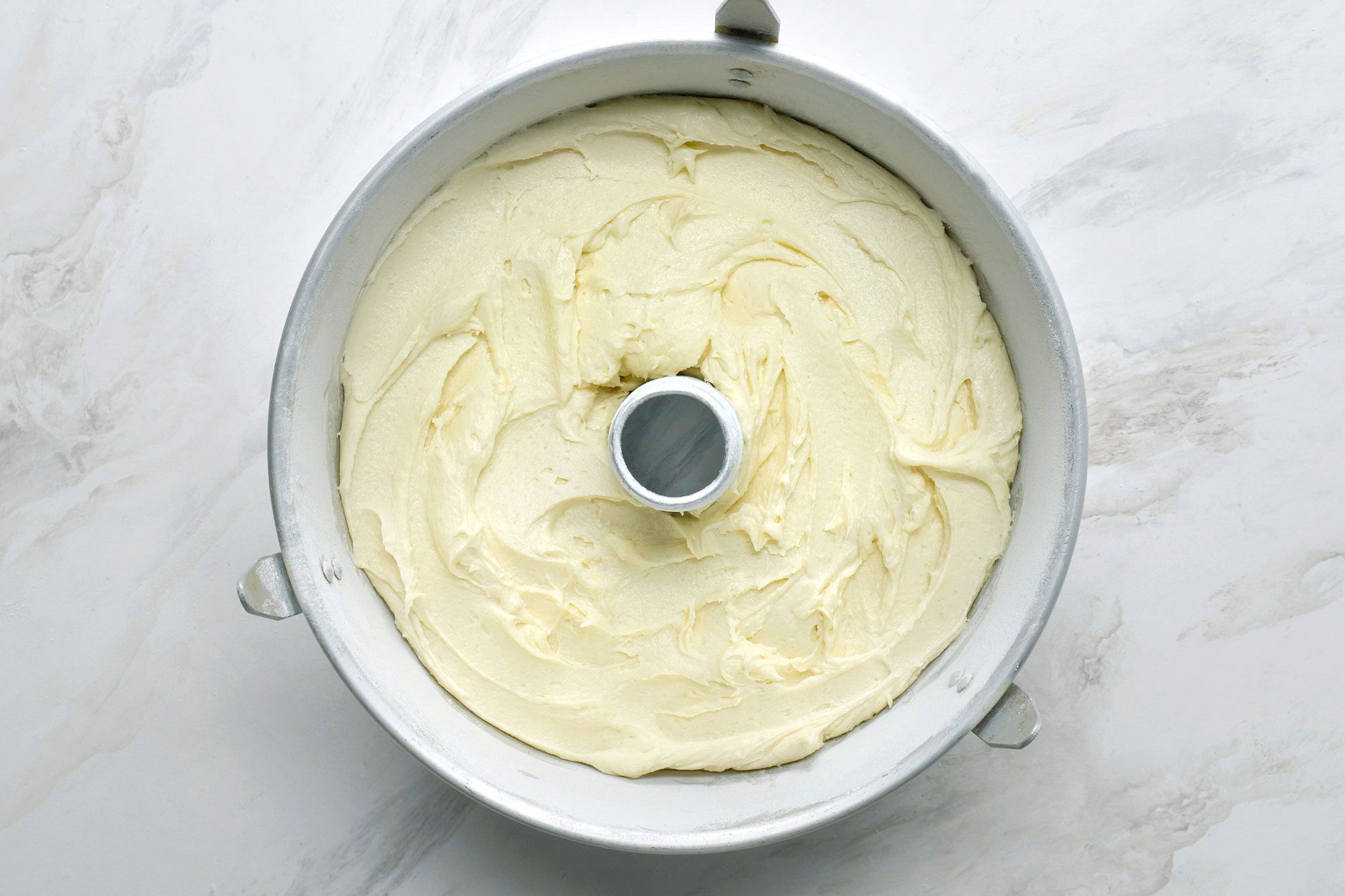 Poured mixture into a greased and floured tube pan