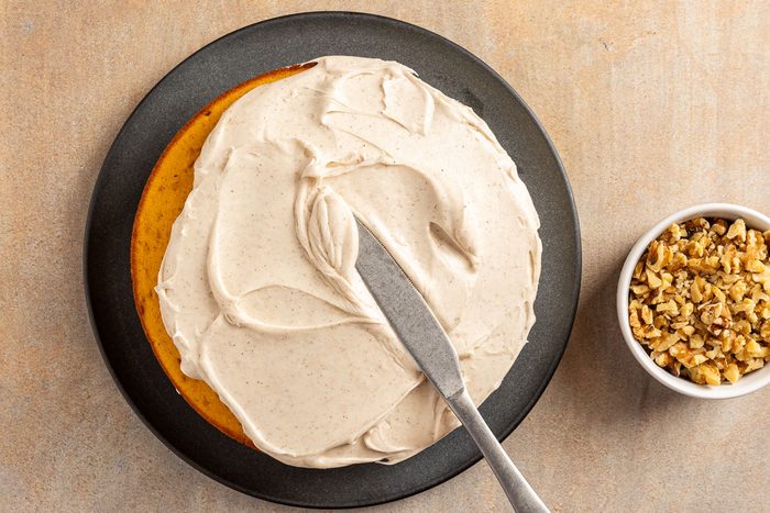 Taste of Home Pumpkin Pie Cake recipe photo of the assembled and frosted cake.