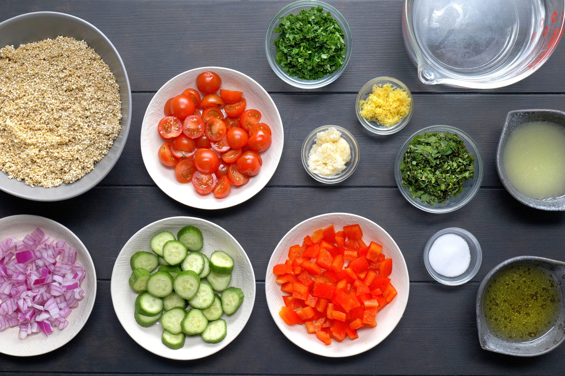 Quinoa, olive oil, lemon zest, lemon juice, garlic, parsley, mint, salt, cucumber, red pepper and red onion.
