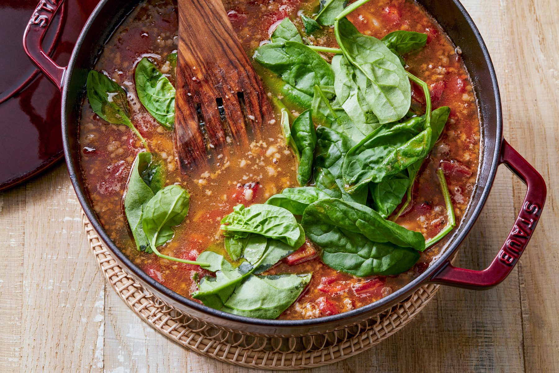 overhead shot; added in spinach until wilted in the large bowl