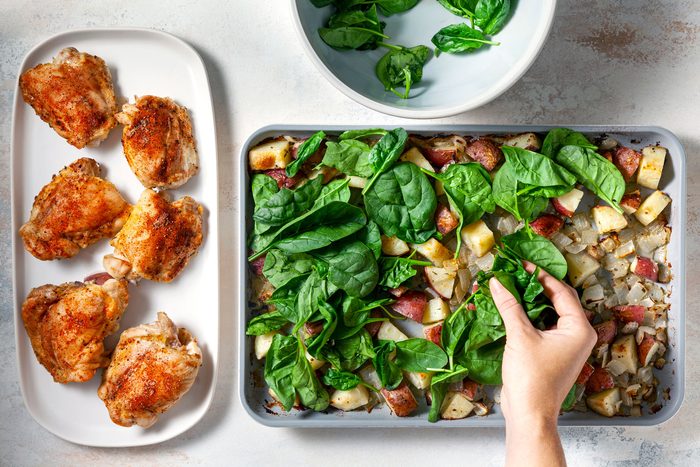 Top vegetables with spinach and Roast until vegetables are tender and spinach is wilted