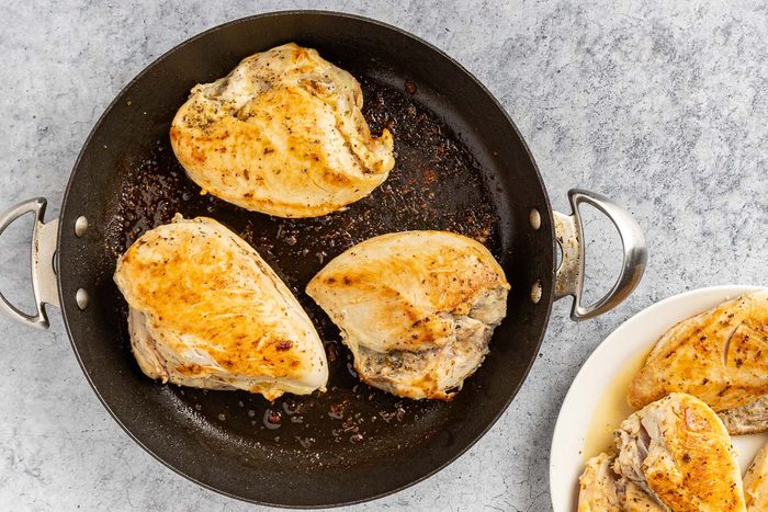 Taste of Home Slow Cooker Lemon Chicken recipe photo of the browned chicken in a skillet.
