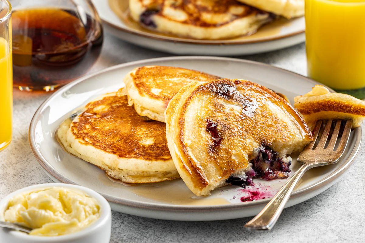 Taste of Home Small Batch Pancakes recipe photo of the finished recipe of pancakes served on plates.