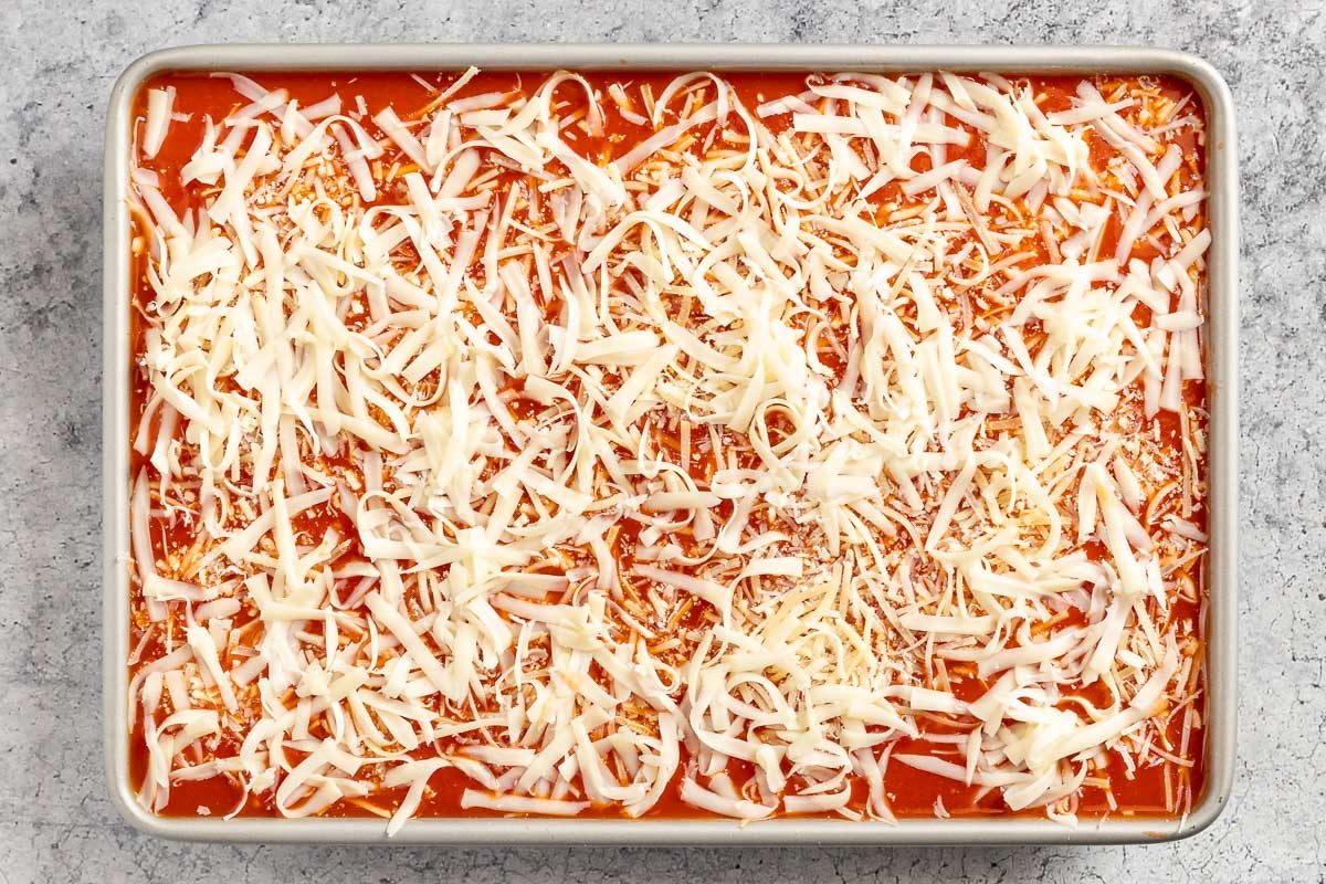 taste of Home Spinach Manicotti recipe photo of filling and arranging the shells in a 13 x 9 baking dish.