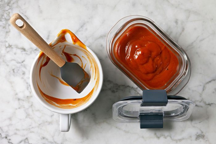 Steak Sauce being transferred to an air-tight container.
