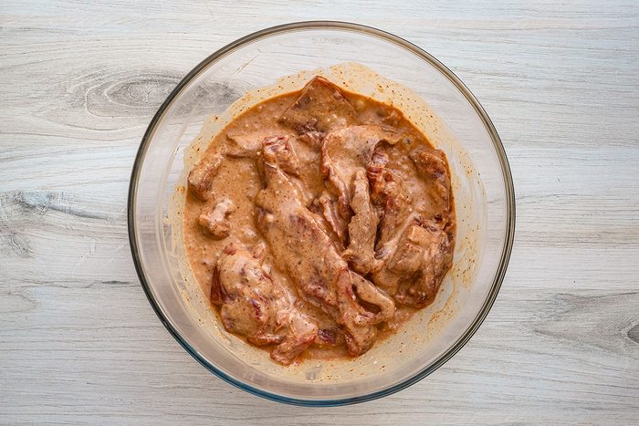 Marinating strips of skirt steak for a beef satay recipe, from Taste of Home.
