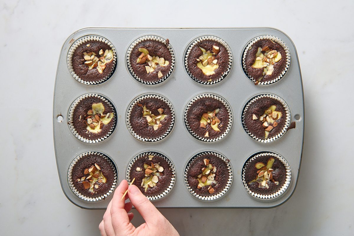 Testing the baked cupcakes with a toothpick