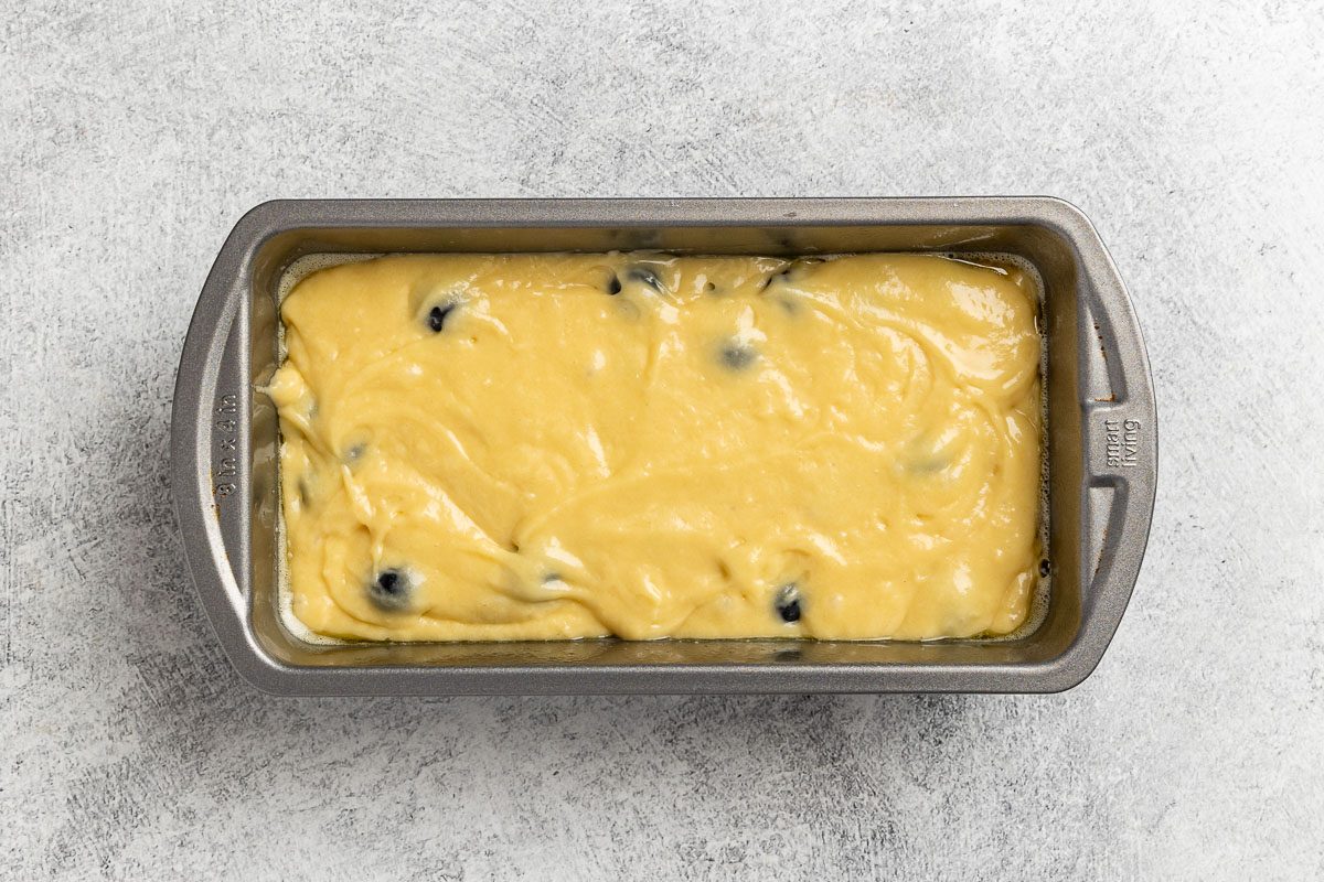 Blueberry Bread batter in a loaf pan