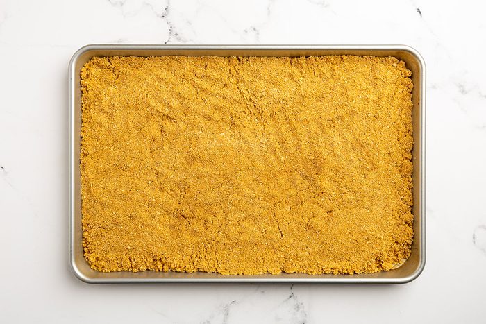 graham cracker crumbs in a sheet pan.