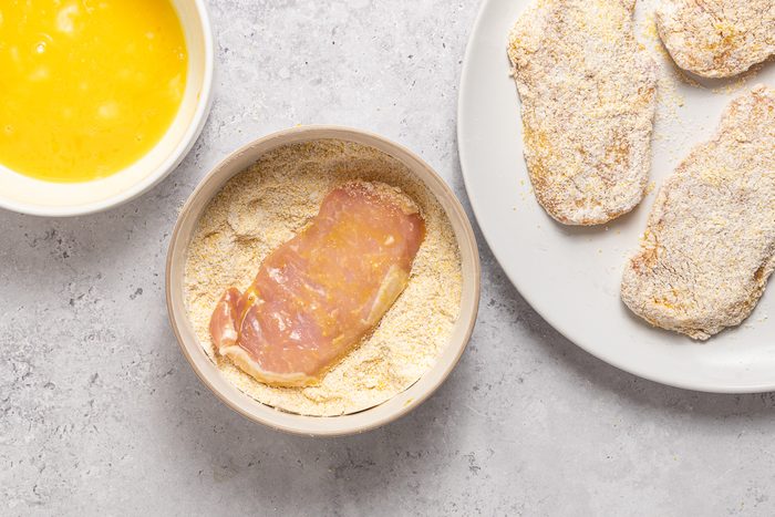 Bowls With Egg, Flour Mix And Breaded Pork Tenderloins