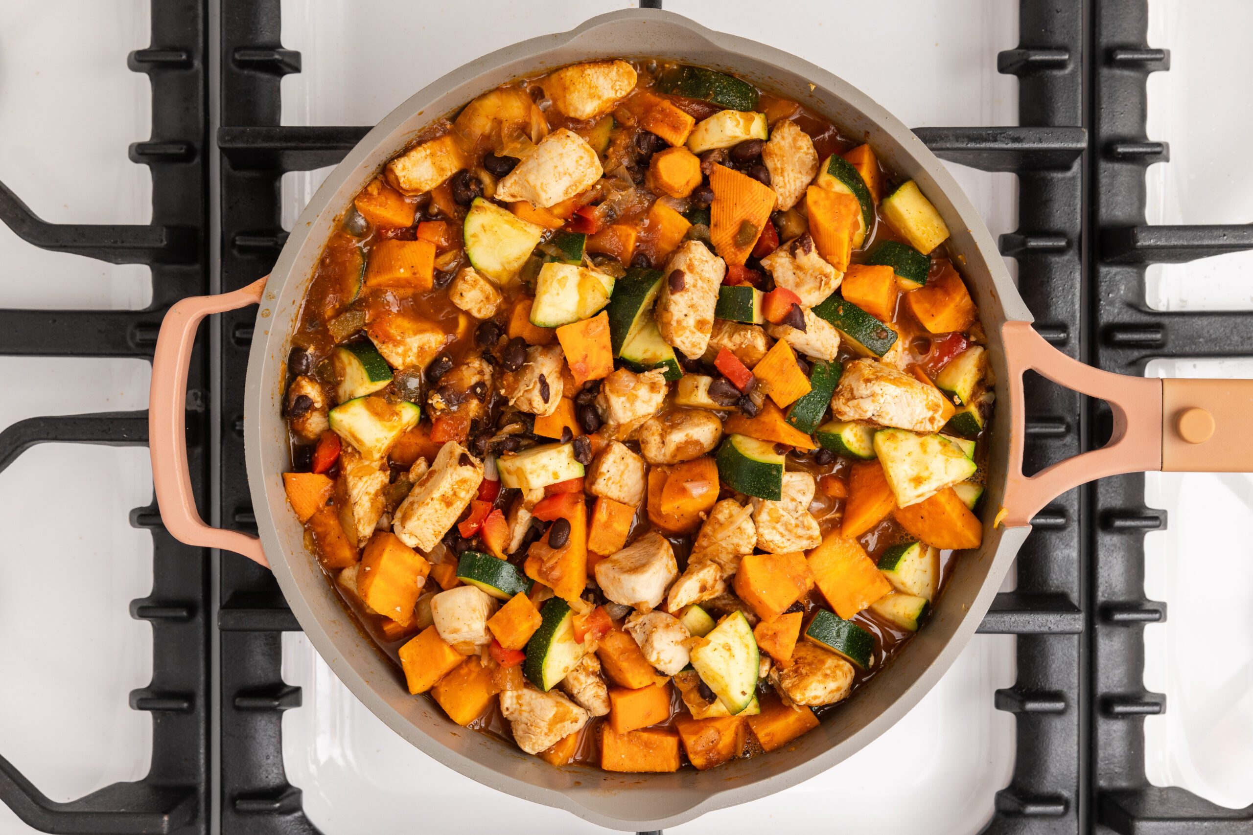 Chicken sweet potato skillet being finalized.