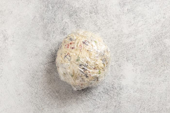 wrapped cheese ball prepped for refrigeration.