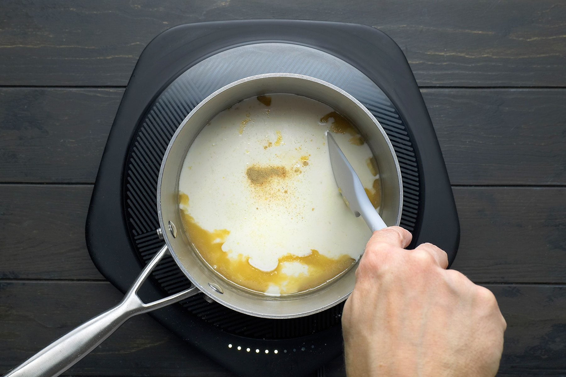 Cream, milk, sugar, salt and pepper added to the flour mixture.