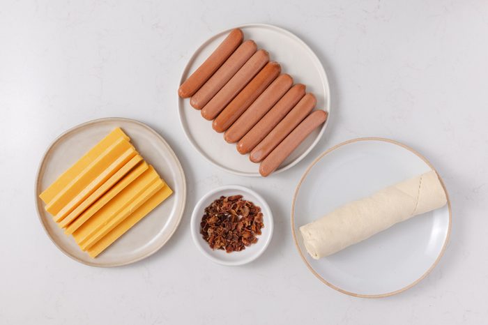 Ingredients for crescent roll hot dogs on kitchen counter.