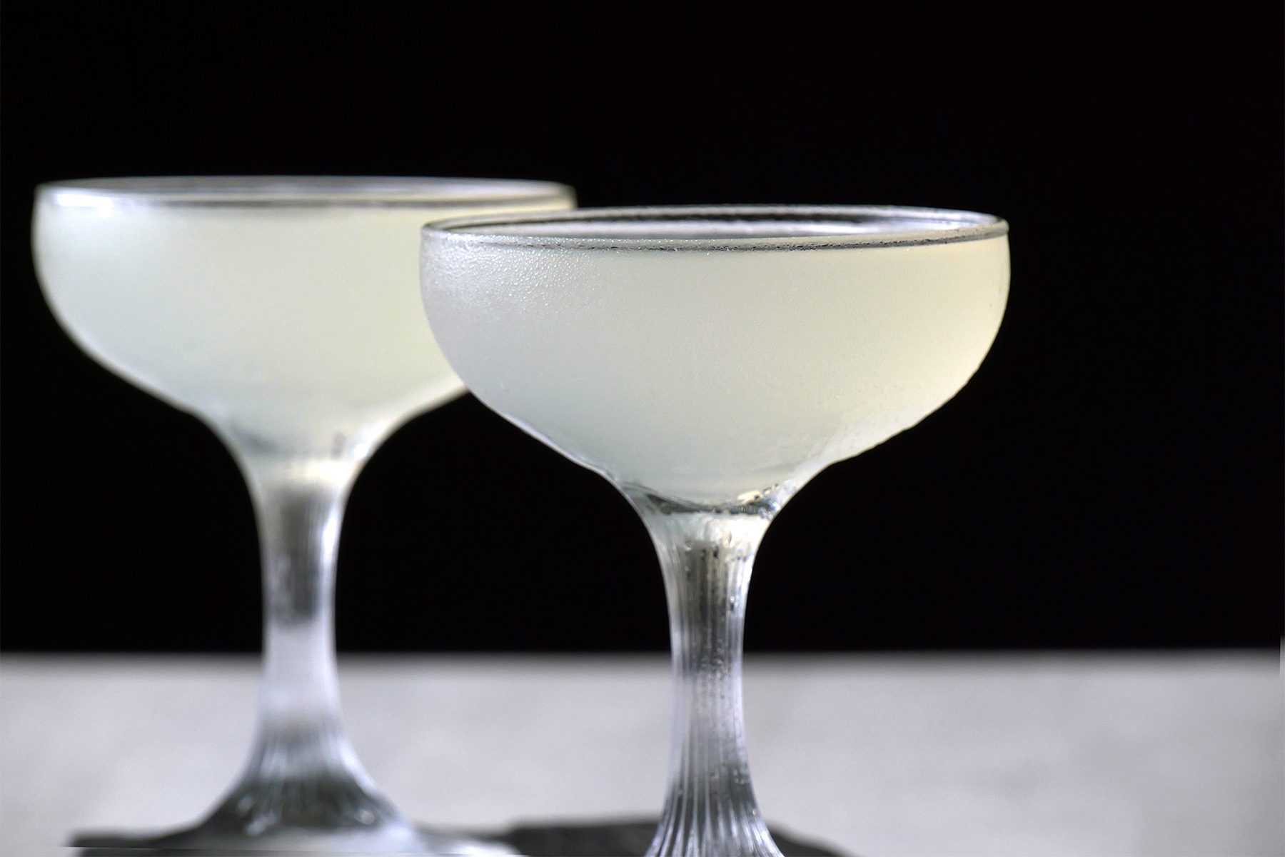 Table view shot of Daiquiri; served on tray; white background;