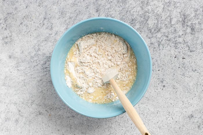 mixing the wet and dry ingredients until moistened.