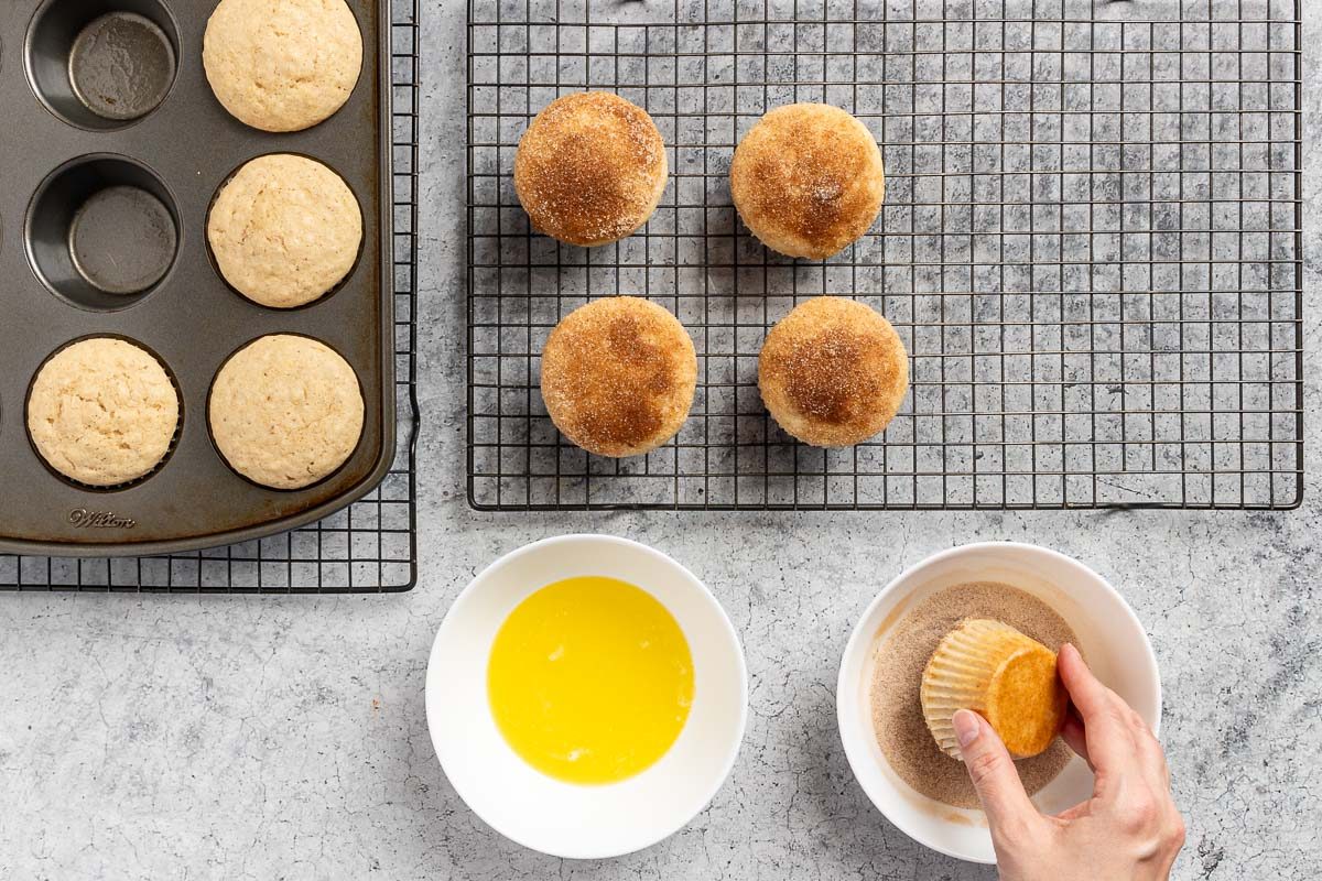 dipping the baked muffins in butter, then in cinnamon sugar.