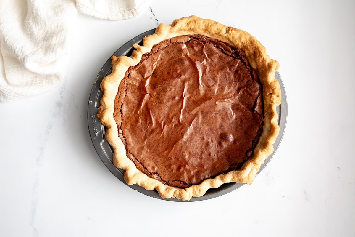 Overhead shot for Taste of Home Fudge Pie, fudge filling in pie crust after baking.