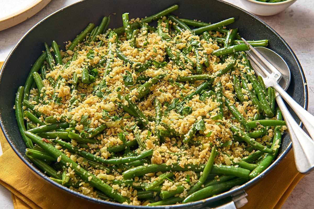 Angled shot of Italian green beans in a large skillet ready to be served